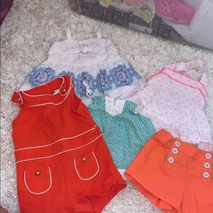 3 shirts, one romper, one short